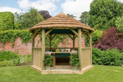 Picture of 3.6m Hexagonal Wooden Garden Gazebo with Thatched Roof - Furnished with Table, Benches and Cushions (Green)