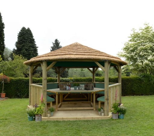 Picture of 4.7m Hexagonal Wooden Garden Gazebo with Thatched Roof - Furnished with Table, Benches and Cushions (Green)